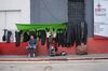 A man sells gun and rifle holsters in Guatemala City.