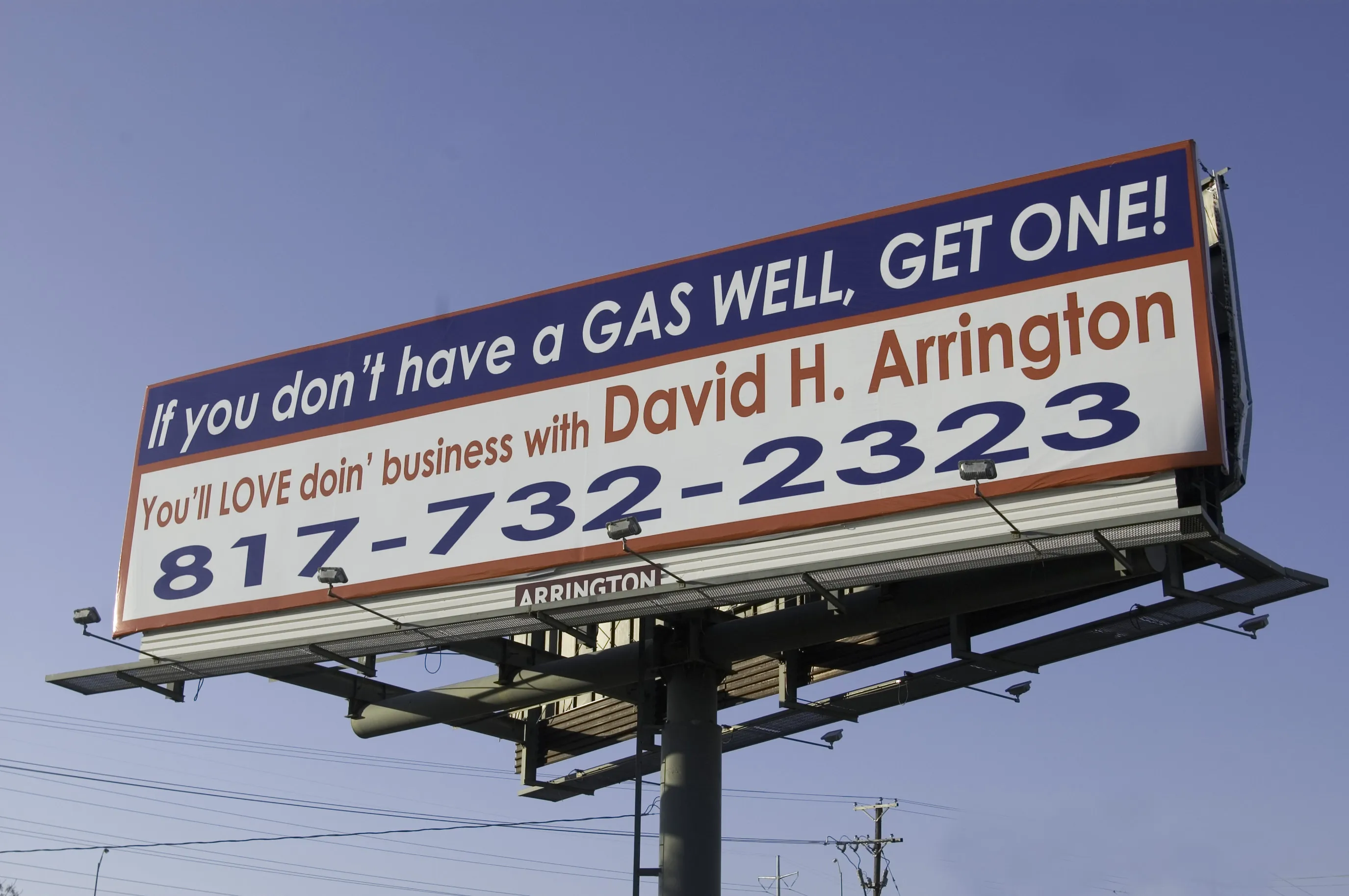 A billboard asks for leasing opportunities along the Interstate highway near downtown of Fort Worth, Texas, February 27, 2006. The Barnett Shale natural-gas boom is creating new investments and growth to the city.
