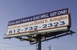 A billboard asks for leasing opportunities along the Interstate highway near downtown of Fort Worth, Texas, February 27, 2006. The Barnett Shale natural-gas boom is creating new investments and growth to the city.