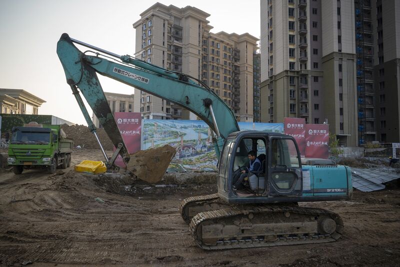 Excavator at the construction site of a China Evergrande Group development in Wuhan, Dec. 22, 2021. 