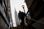 A commuter exits a Penn Station subway exit in New York.