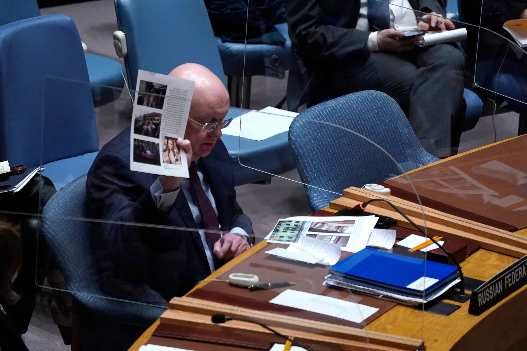 Russia Ambassador to the United Nations, Vasily Nebenzya,&nbsp;shows documents during a March 2022 UN Security Council emergency meeting after the country&nbsp;accused the US of funding research into the development of biological weapons in Ukraine (Photo by TIMOTHY A. CLARY/AFP via Getty Images)