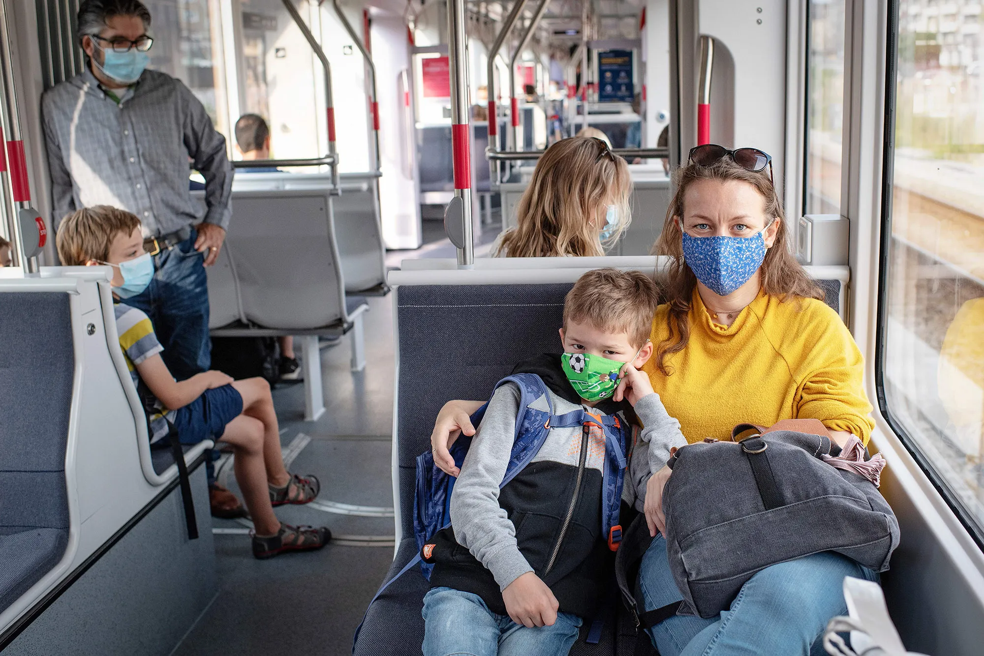 Passengers wearing protective face masks riding a tram in Aarhus on Aug.&nbsp;10.