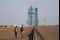 epa05587719 Chinese staff members walk in front of the Long March 2F carrier rocket carrying the Shenzhou-11 spacecraft ahead of its launch at the Jiuquan Satellite Launch Center in Jiuquan in Gansu province, China, 16 October 2016. China will launch Shenzhou-11 spacecraft carrying two crew members into orbit to dock with the Tiangong-2 space lab on a 30-day mission on 17 October 2016. EPA/HOW HWEE YOUNG