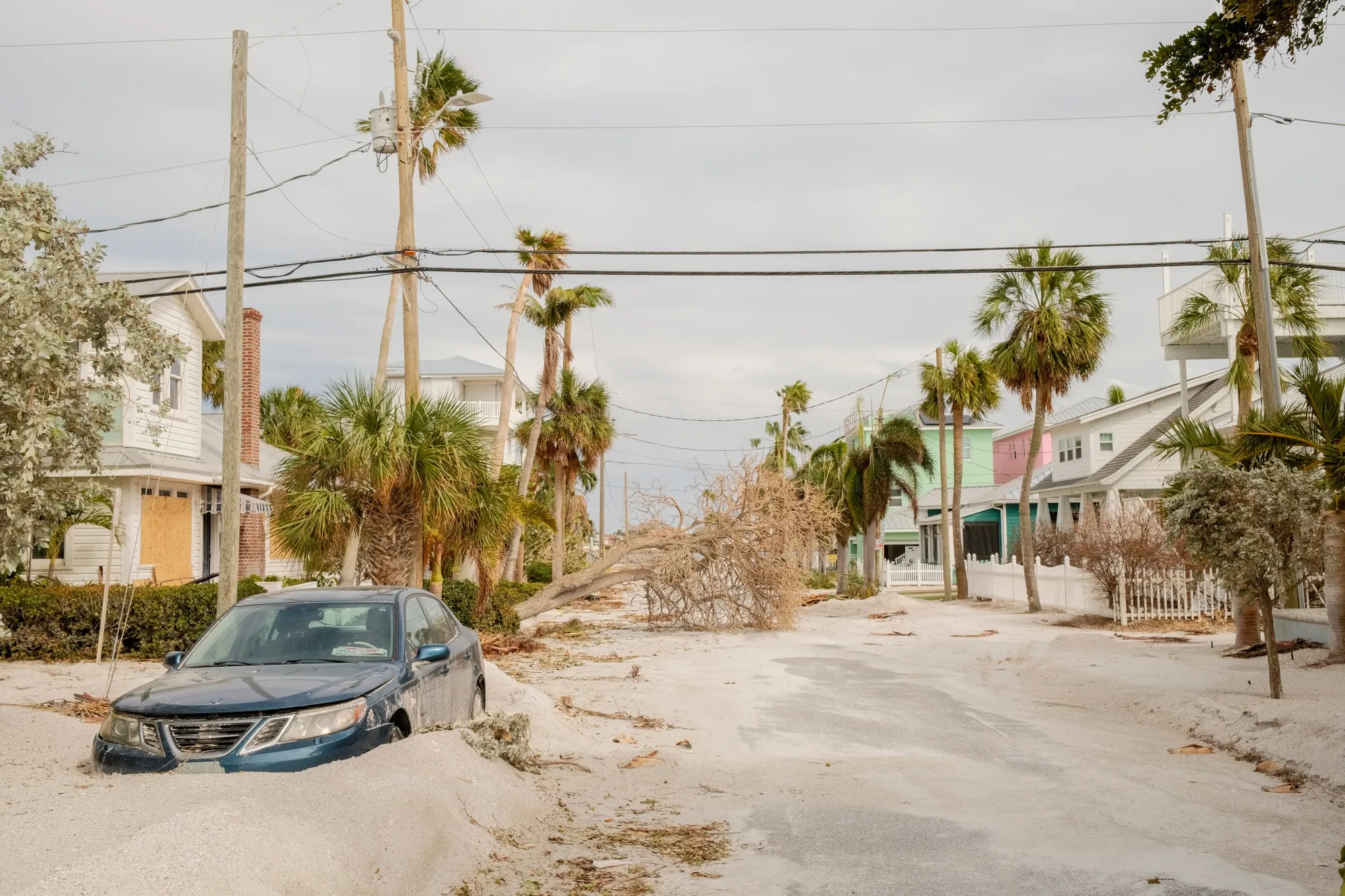 A downed tree and blocked-in vehicle in St. Pete Beach, Florida, on Oct. 11.