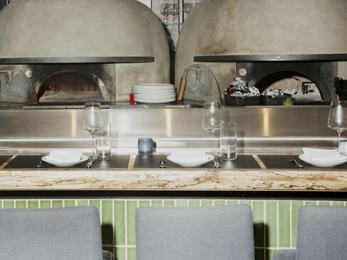The dining room seats just over 50, with several seats at the counter in front of the open kitchen.