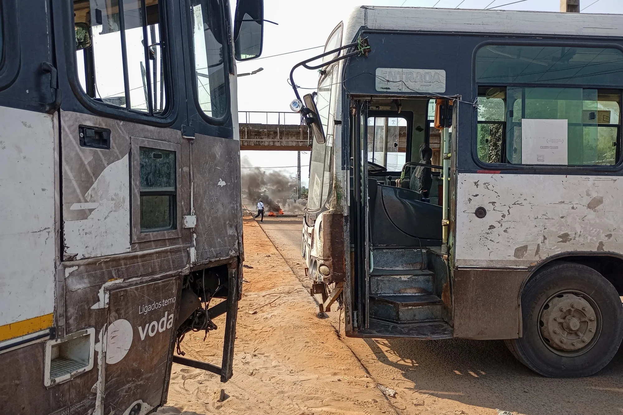 Buses block&nbsp;a road&nbsp;after police dispersed protesters in Maputo, on March 5.