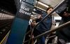 Commuters exit a Wall Street subway station near the New York Stock Exchange (NYSE) in New York, U.S., on Monday, April 24, 2017. U.S. stocks climbed as the weekend vote in France triggered a rally in global equities, and President Trump vowed to announce tax reforms this week.