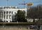Greenpeace protesters unfold a banner reading "Resist" from atop a construction crane behind the White House Jan. 25, 2017.