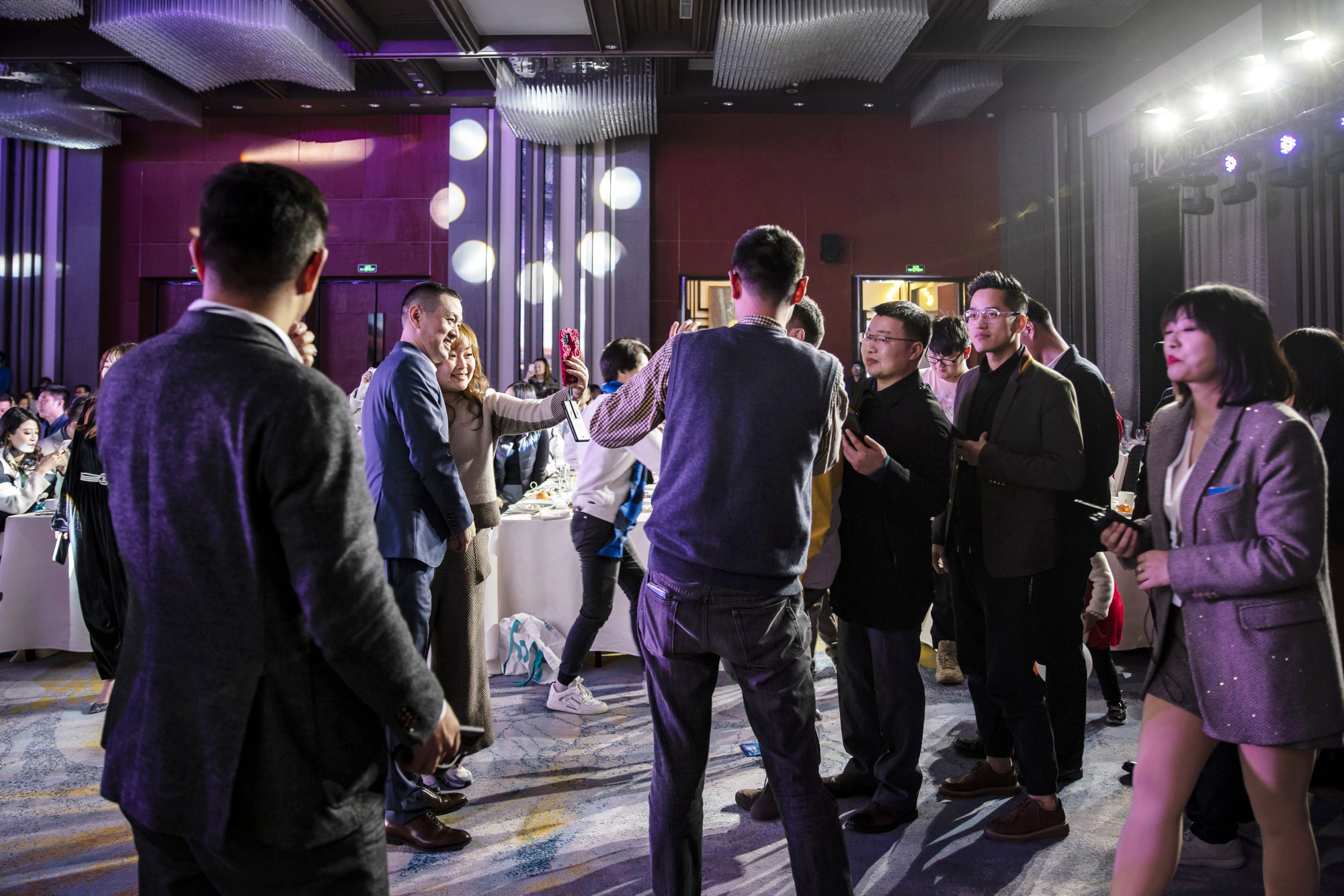 William Li takes time to have his photo at a gala dinner hosted by loyal customers in Shanghai, on March 21.