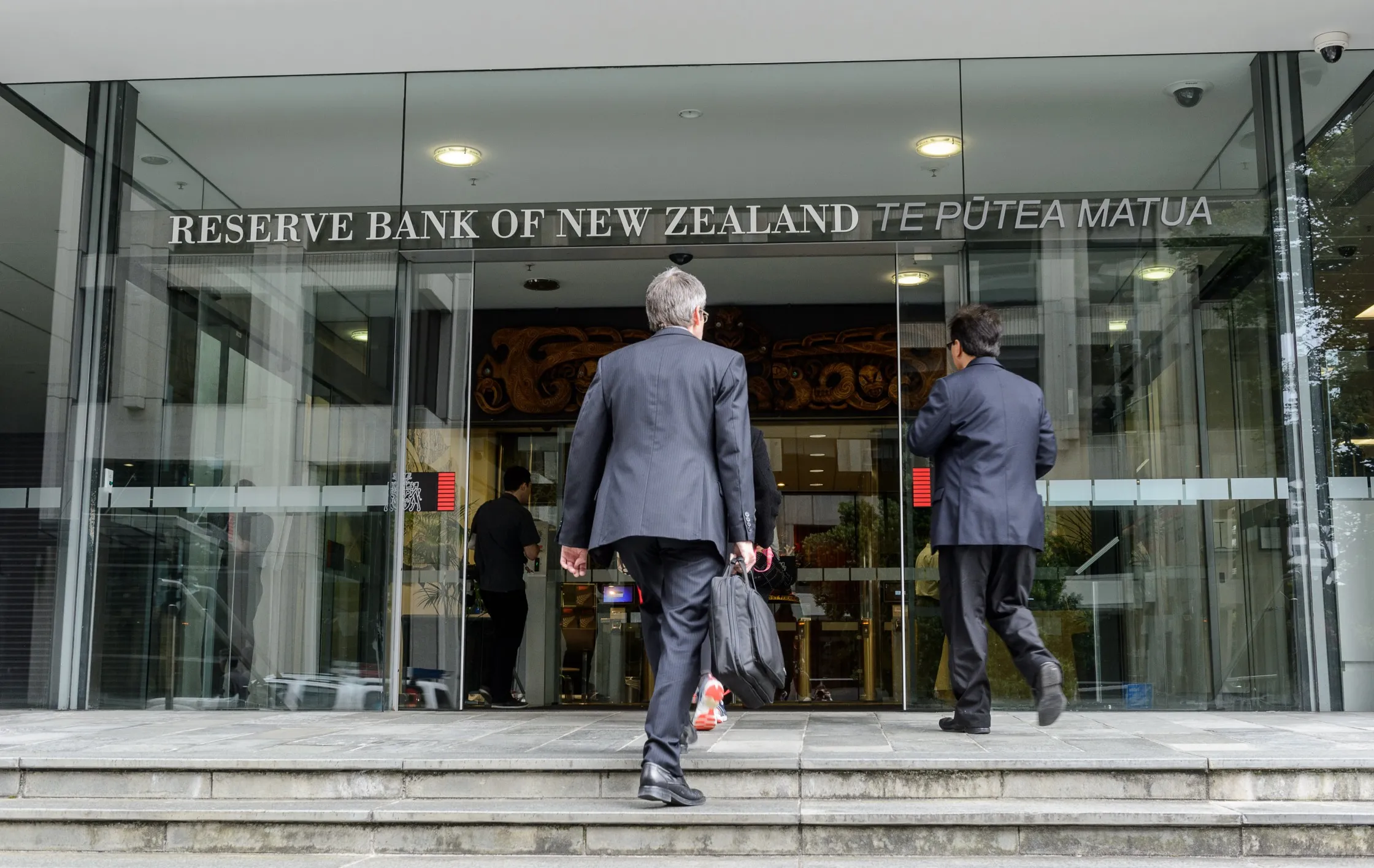 People enter the Reserve Bank of New Zealand.