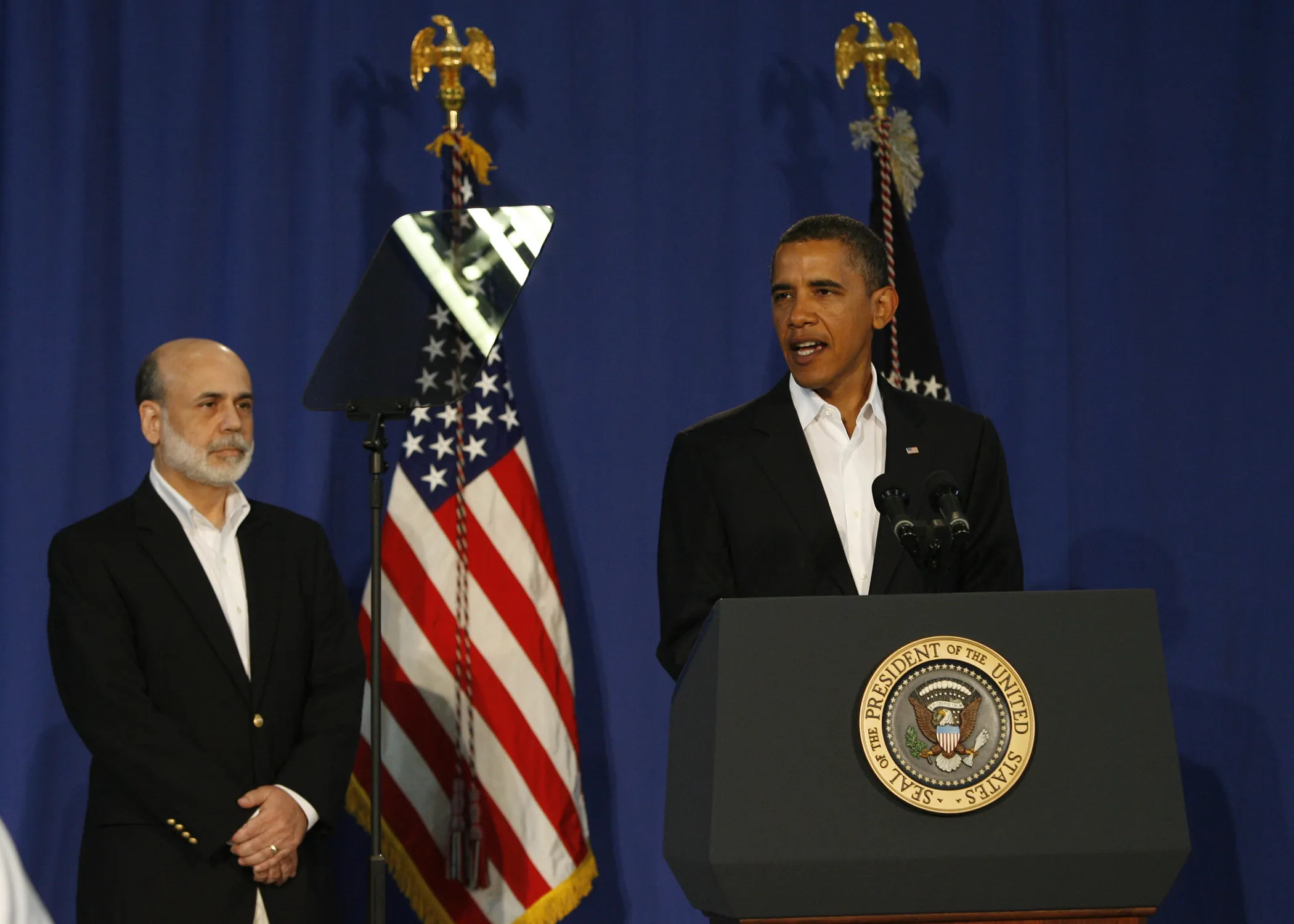 President Barack Obama taps Ben Bernanke for a second term at Martha’s Vineyard in 2009.