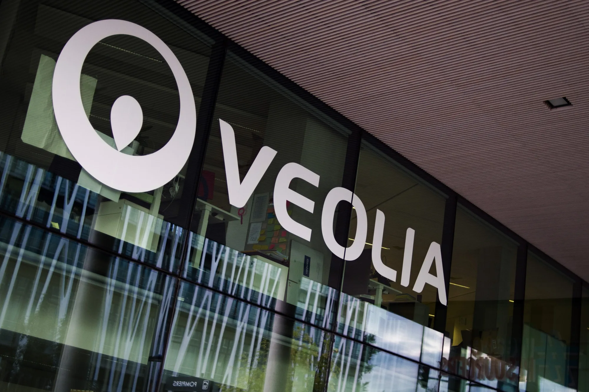 A company logo sits on display at the Veolia Environnement SA headquarters in Paris, France, on Wednesday, Sept. 30, 2020. Engie SA got five more days to consider Veolia Environnement SA’s 3.4 billion-euro bid ($4 billion) for most of its stake in Suez SA, prolonging a corporate fight in the hope of making it less hostile.