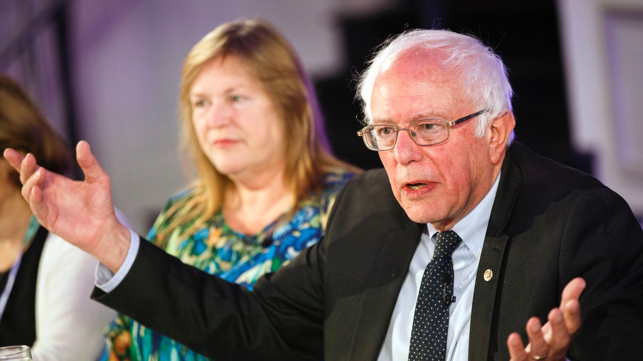 Senator Bernie Sanders speaks next to his wife, Jane, during a Bloomberg Politics breakfast on the sidelines of the Democratic National Convention in Philadelphia on July 26, 2016.

