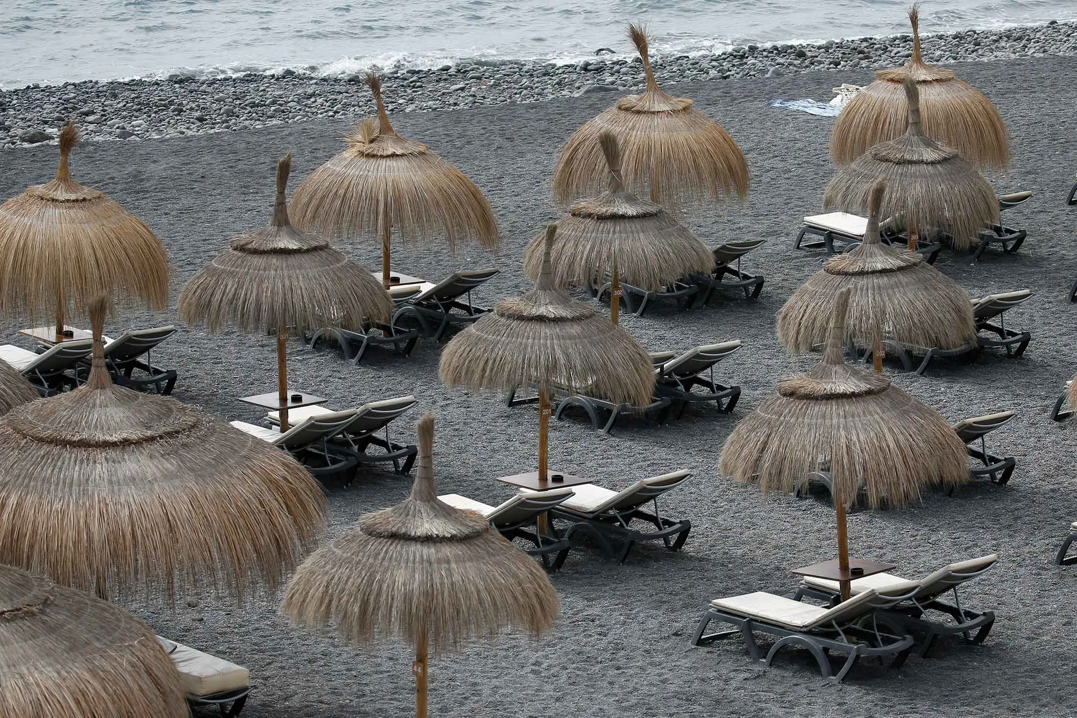 Empty sun beds at La Caleta beach on the island of Tenerife on Feb. 27.