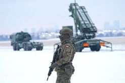A soldier stands near a Patriot surface-to-air missile system in Warsaw.