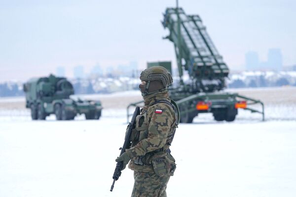 A soldier stands near a Patriot surface-to-air missile system in Warsaw.