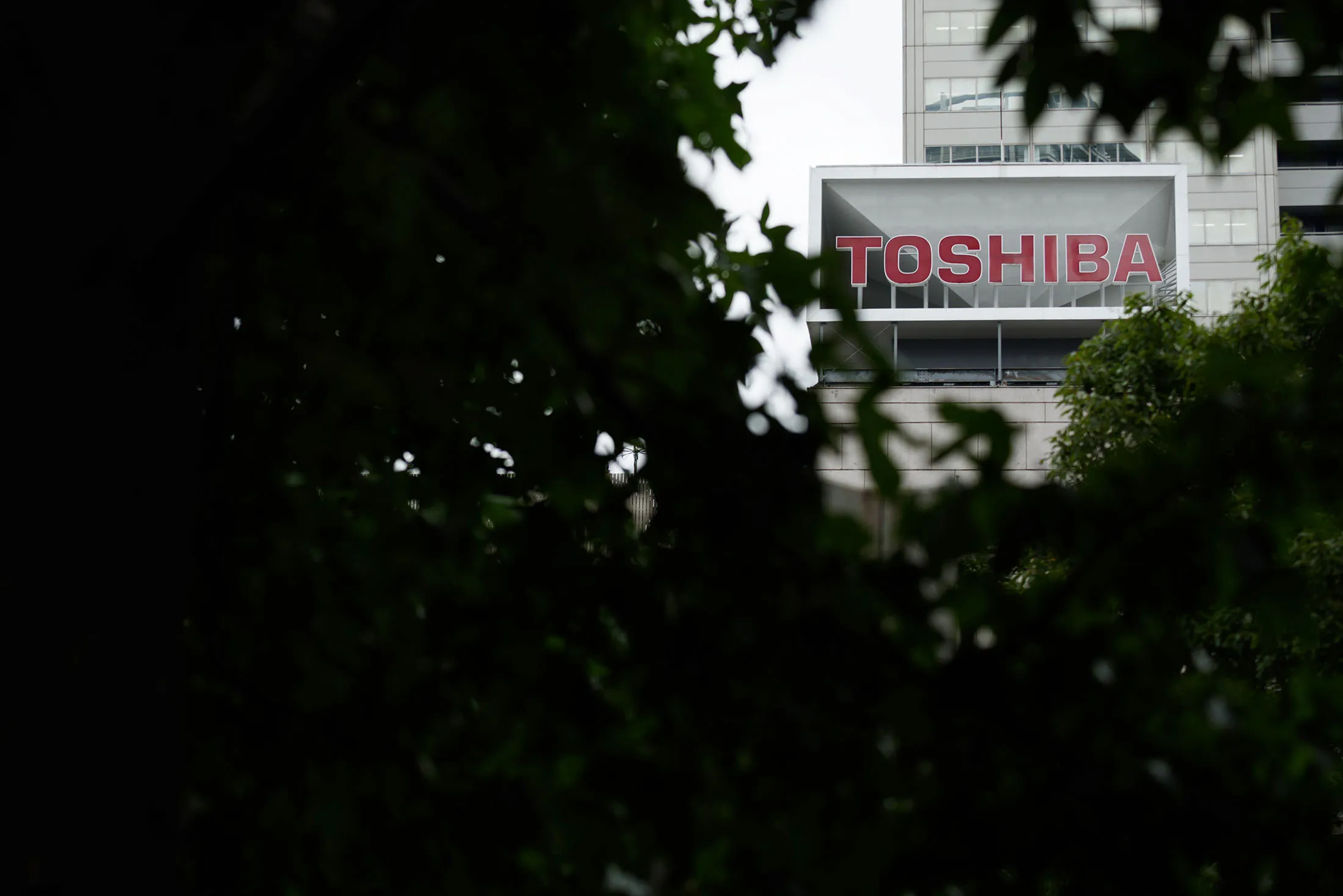 The Toshiba Corp. logo is displayed atop the company's headquarters in Tokyo, Japan, on Monday, August 31, 2015.
