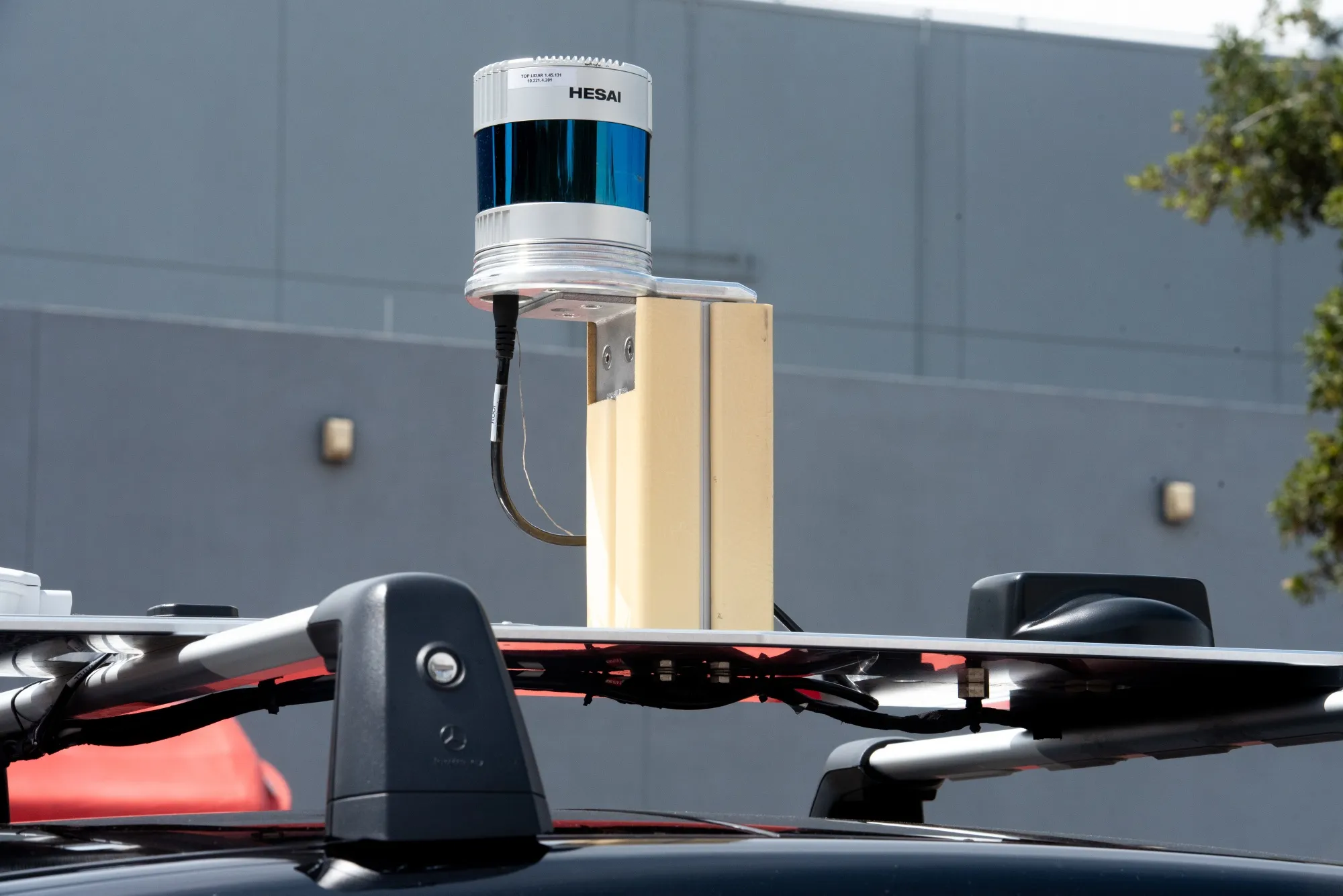 A Lidar sensor on top of a test car.