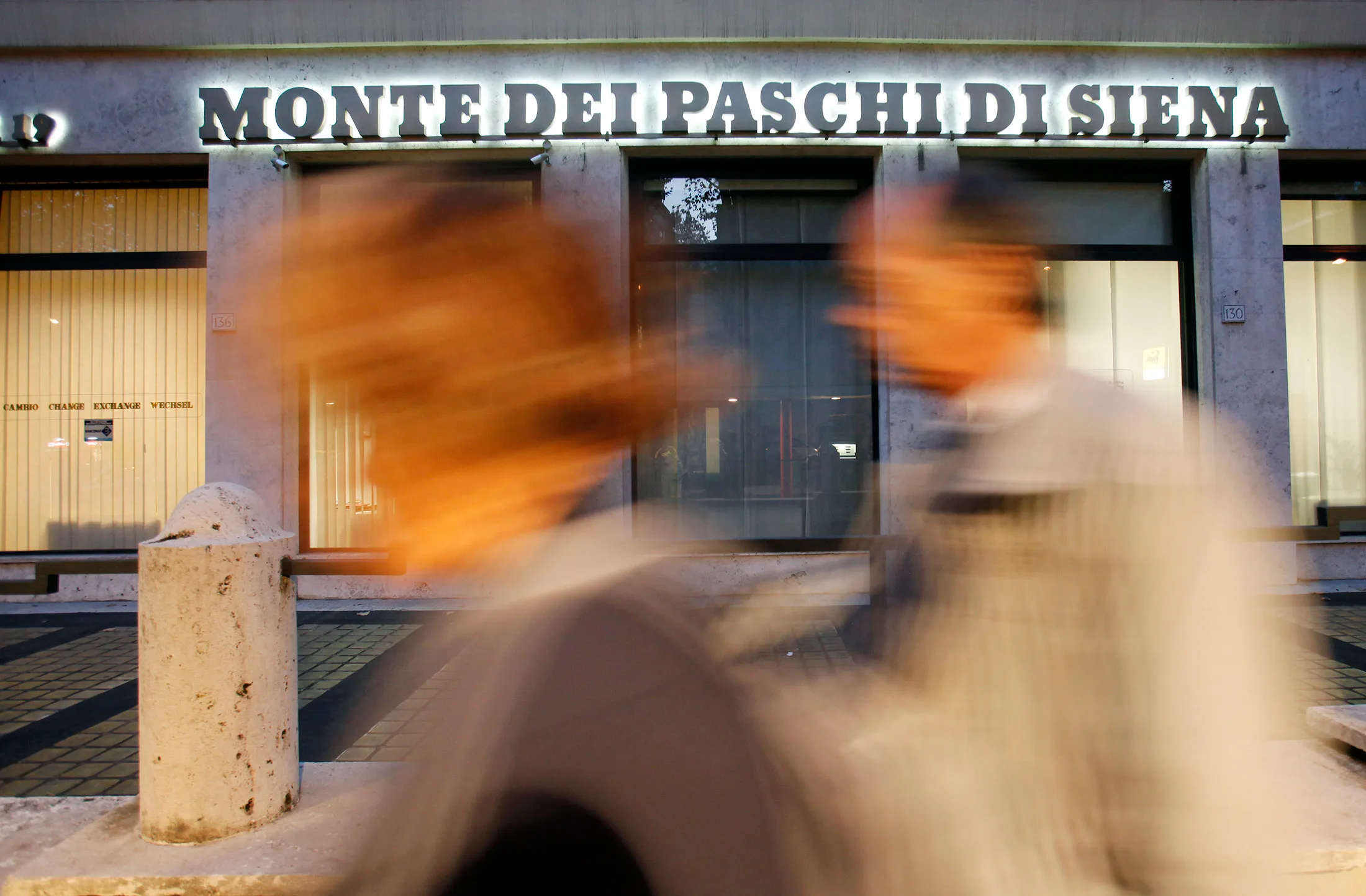 Pedestrians pass a Banca Monte dei Paschi di Siena SpA branch in Rome
