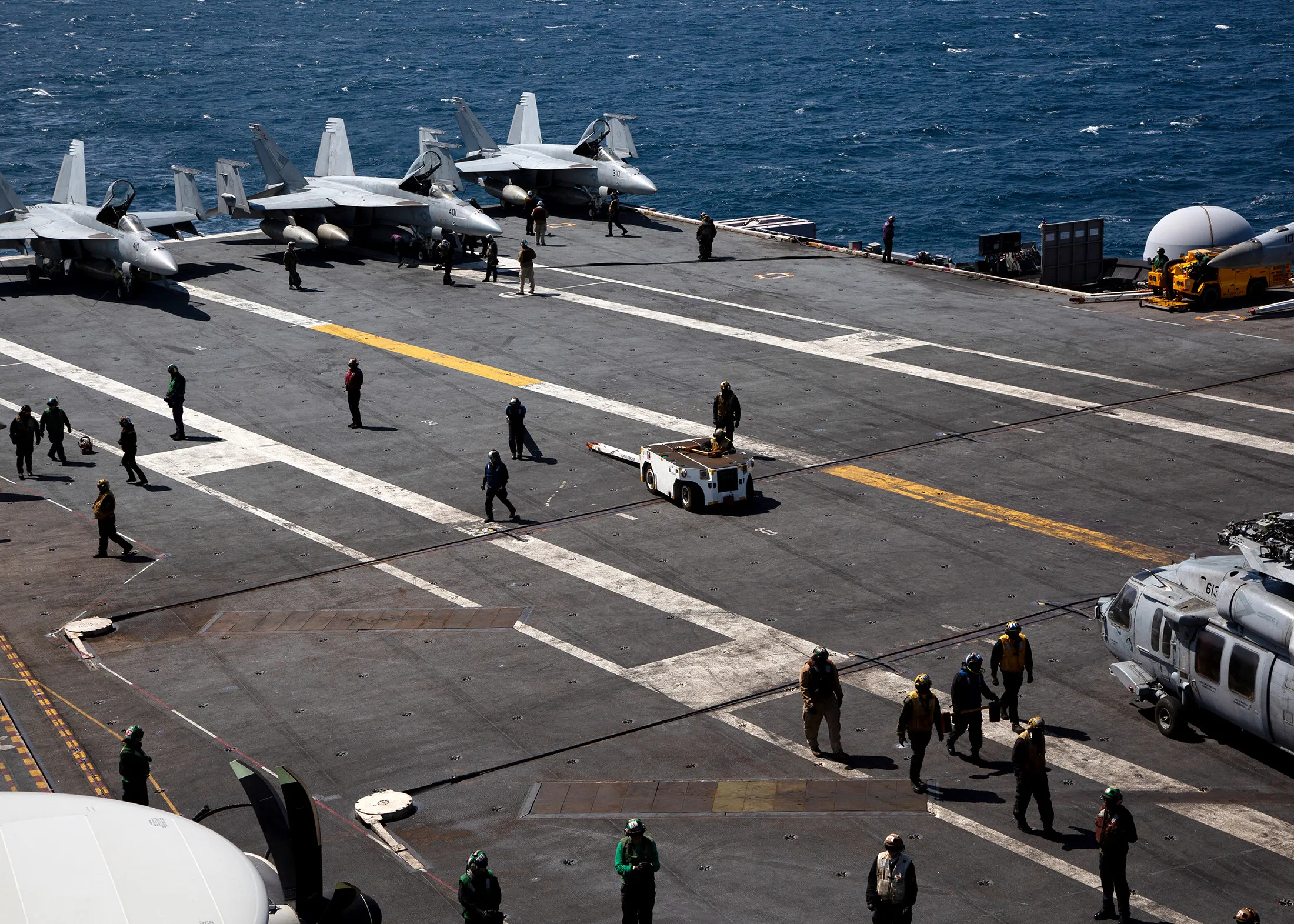 US navy F-18 Super Hornets and crew on the flight deck of the USS Aircraft Carrier Nimitz during an South Korea and US combined maritime exercise as a part of Warrior Shield at sea off the coast of South Korea&nbsp;on March 27.