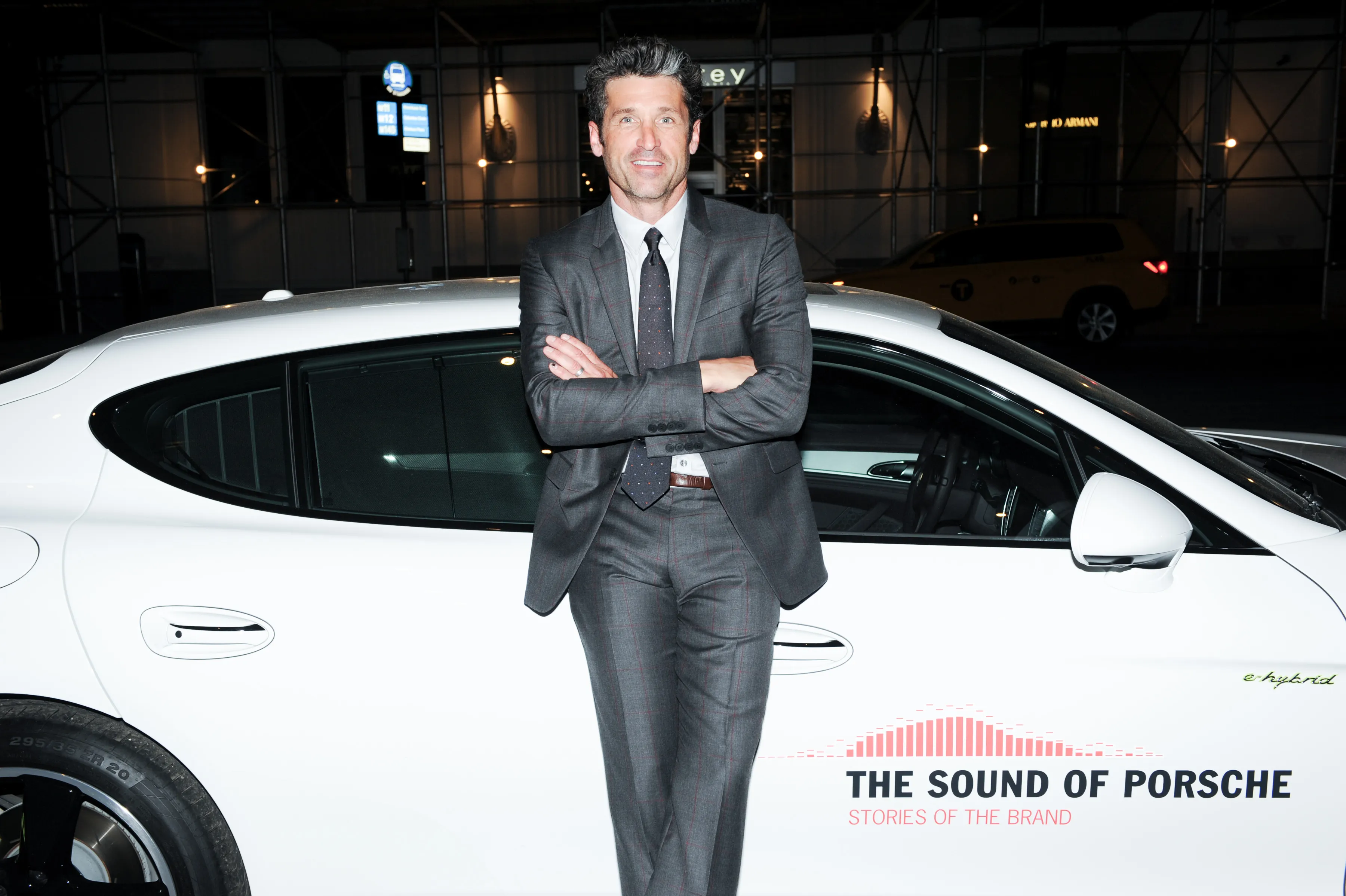 Patrick Dempsey, standing in front of a Porsche Panamera, hosts the opening of the Porsche design boutique this week in New York's Meatpacking District. Source: BFA/Porsche