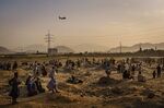 A military transport plane takes off from Kabul airport as people remain&nbsp;stranded outside, in Kabul, Afghanistan.