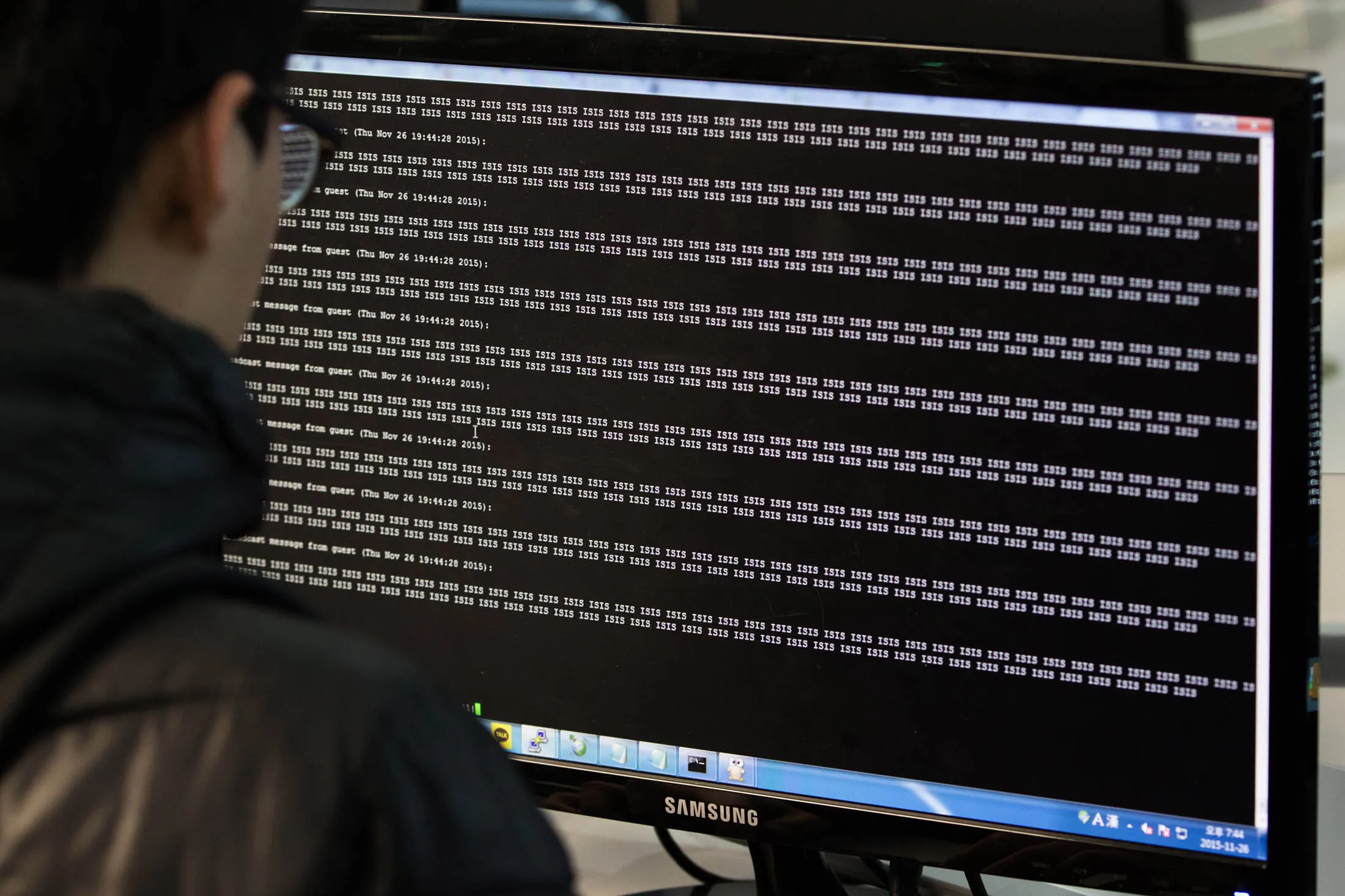 A student looks at text reading 'ISIS' displayed on a computer monitor during a cyber-defense programming class in the 'War Room' at Korea University.
