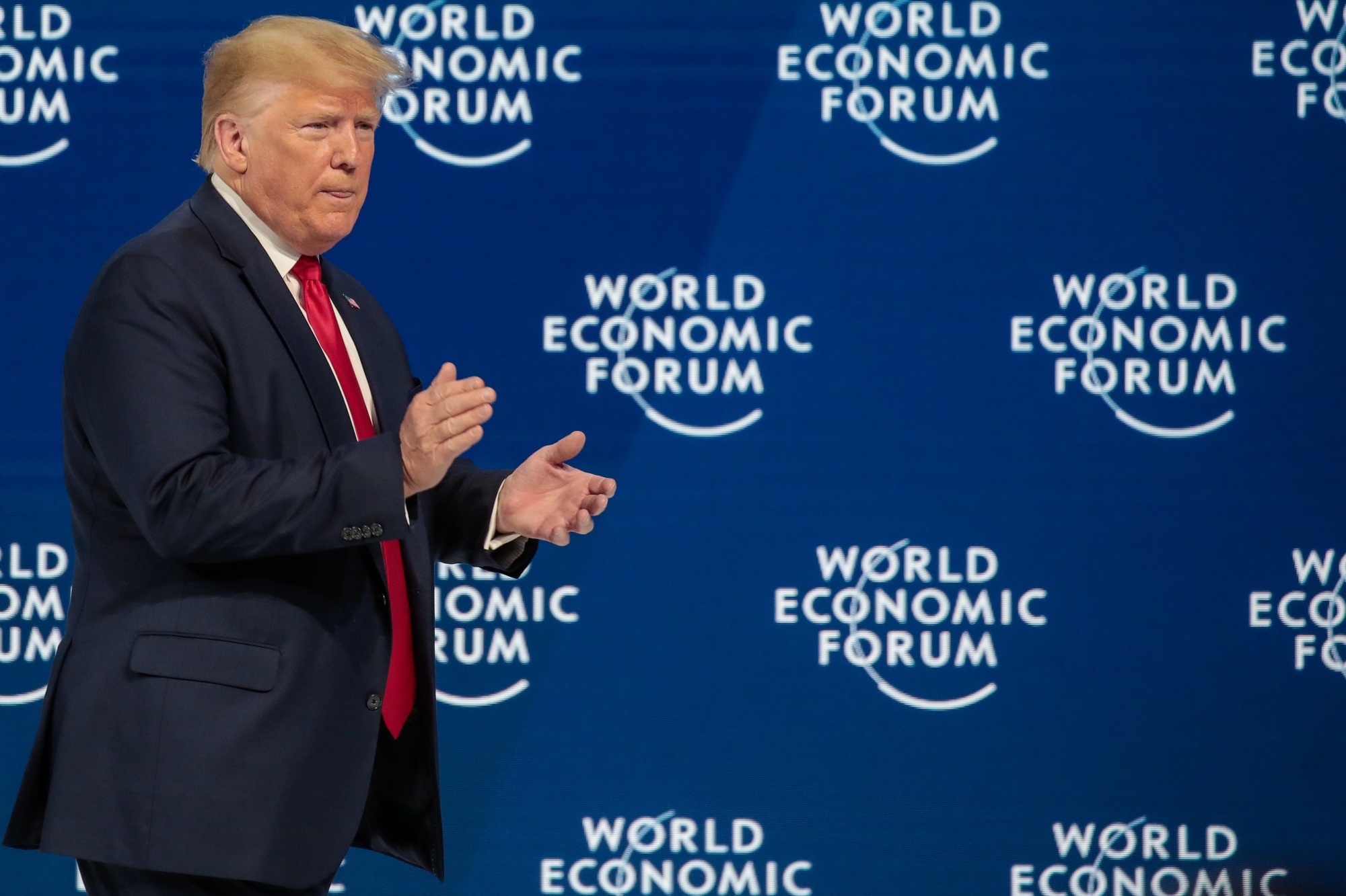 U.S. President Donald Trump applauds during a special address on the opening day of the World Economic Forum in Davos.