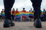 People wave rainbow flags during a rally in Saint Petersburg in 2017.&nbsp;