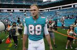 Miami Dolphins tight end Mike Gesicki (88) walks on the field ahead of an NFL football game against the New England Patriots, Sunday, Jan. 9, 2022, in Miami Gardens, Fla. The Miami Dolphins placed the franchise tag on tight end Mike Gesicki on Tuesday, March 8, which will keep him under contract for the 2022 season. (AP Photo/Willfredo Lee, File)
