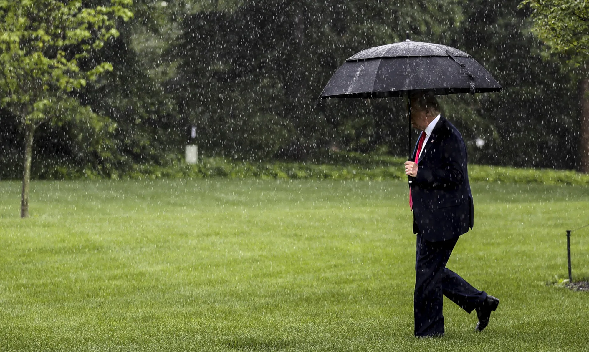 Donald Trump walks outside the White House before boarding Marine One in Washington on June 11.