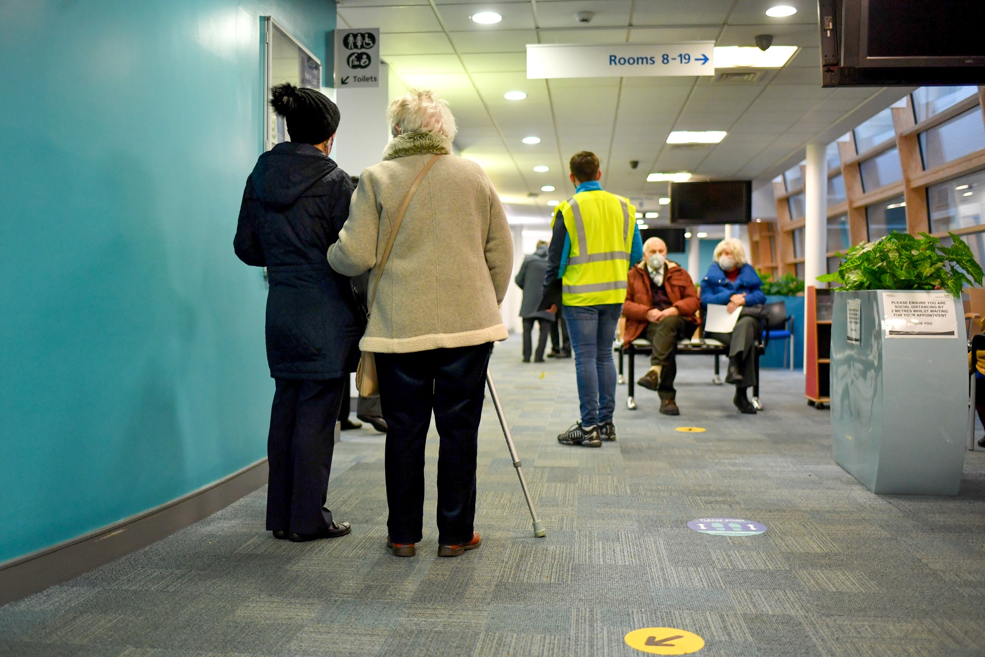 Visitors wait for&nbsp;vaccines at the Royal Health &amp; Wellbeing Centre in Oldham, U.K.