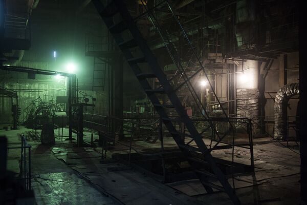 Green light illuminates the interior of an area in the plant room at the Trypilska thermal power station near Kiev, Ukraine,