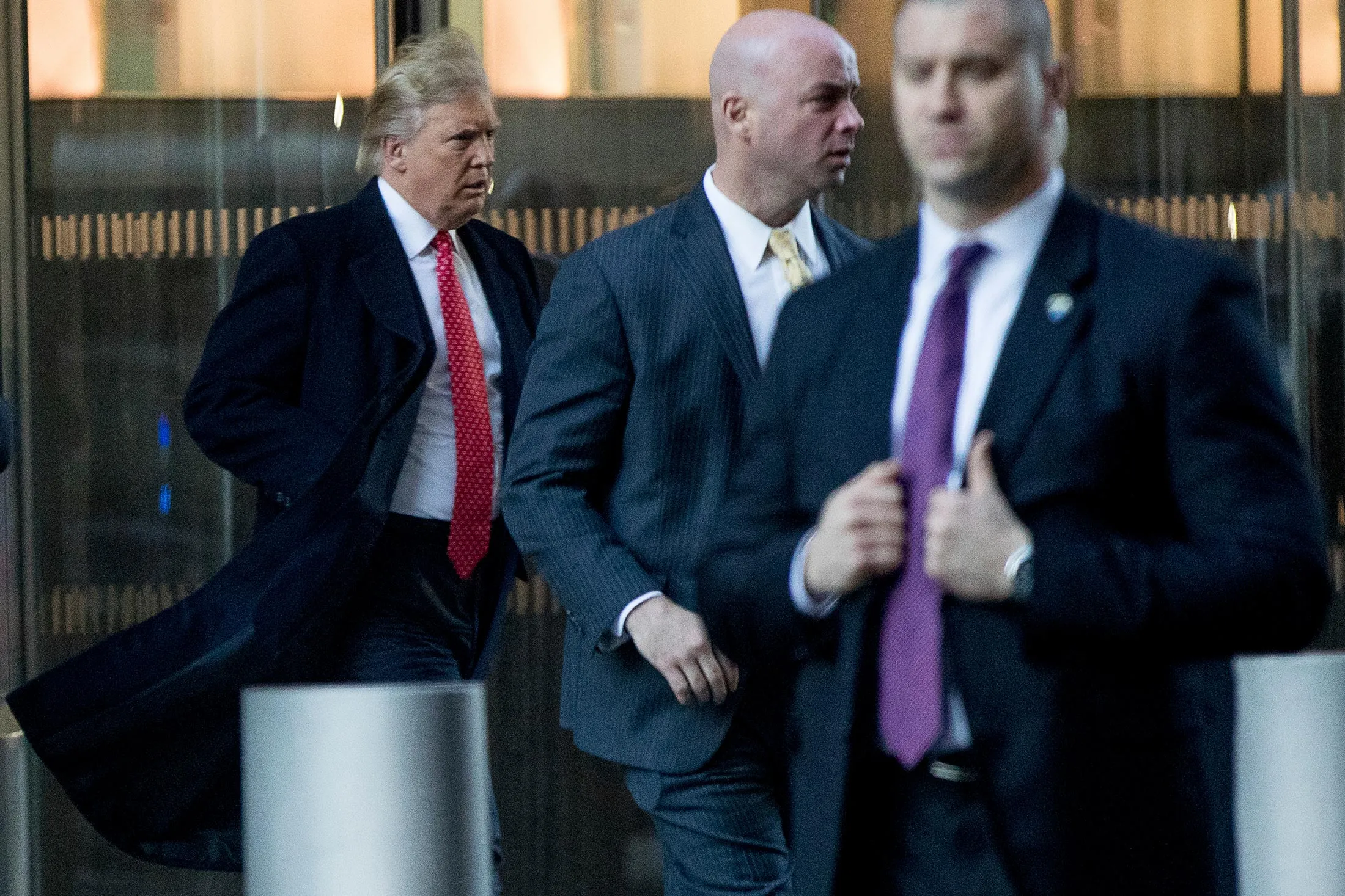 President-elect Donald Trump, left, departs a meeting at the Condé Nast offices at One World Trade Center in New York, on Jan. 6, 2017.
