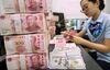 A Chinese bank employee counts 100-yuan notes and US dollar bills at a bank counter in Nantong in China's eastern Jiangsu province on August 28, 2019. - China's currency slid on August 26 to its weakest point in more than 11 years as concerns over the US trade war and the potential for global recession weighed on markets. (Photo by STR / AFP) / China OUT (Photo credit should read STR/AFP/Getty Images)