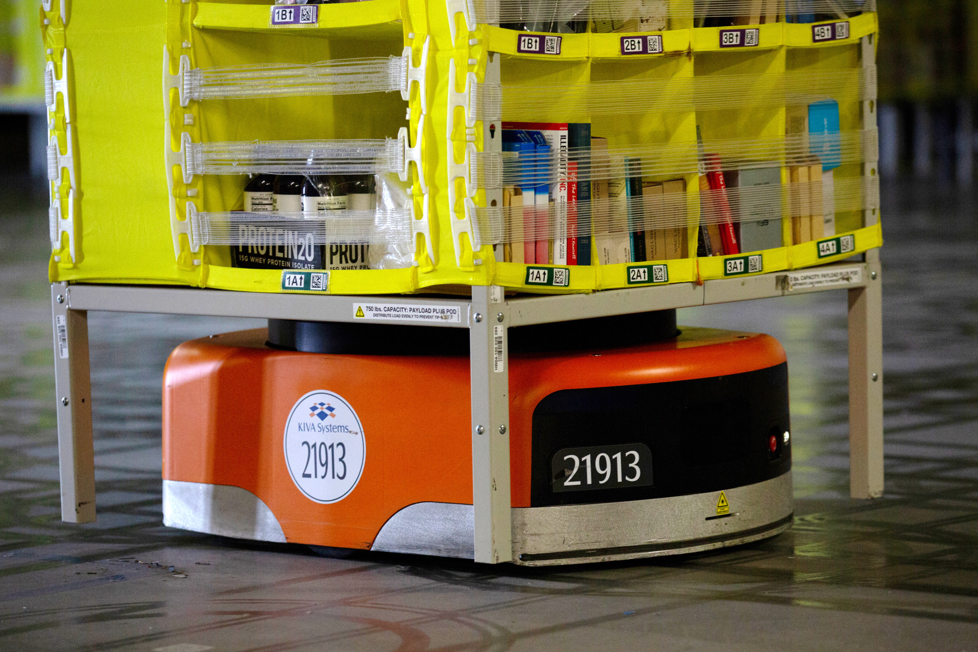 An automated transport robot moves goods in a storage unit at the Amazon.com Inc. fulfillment center in Robbinsville, New Jersey.