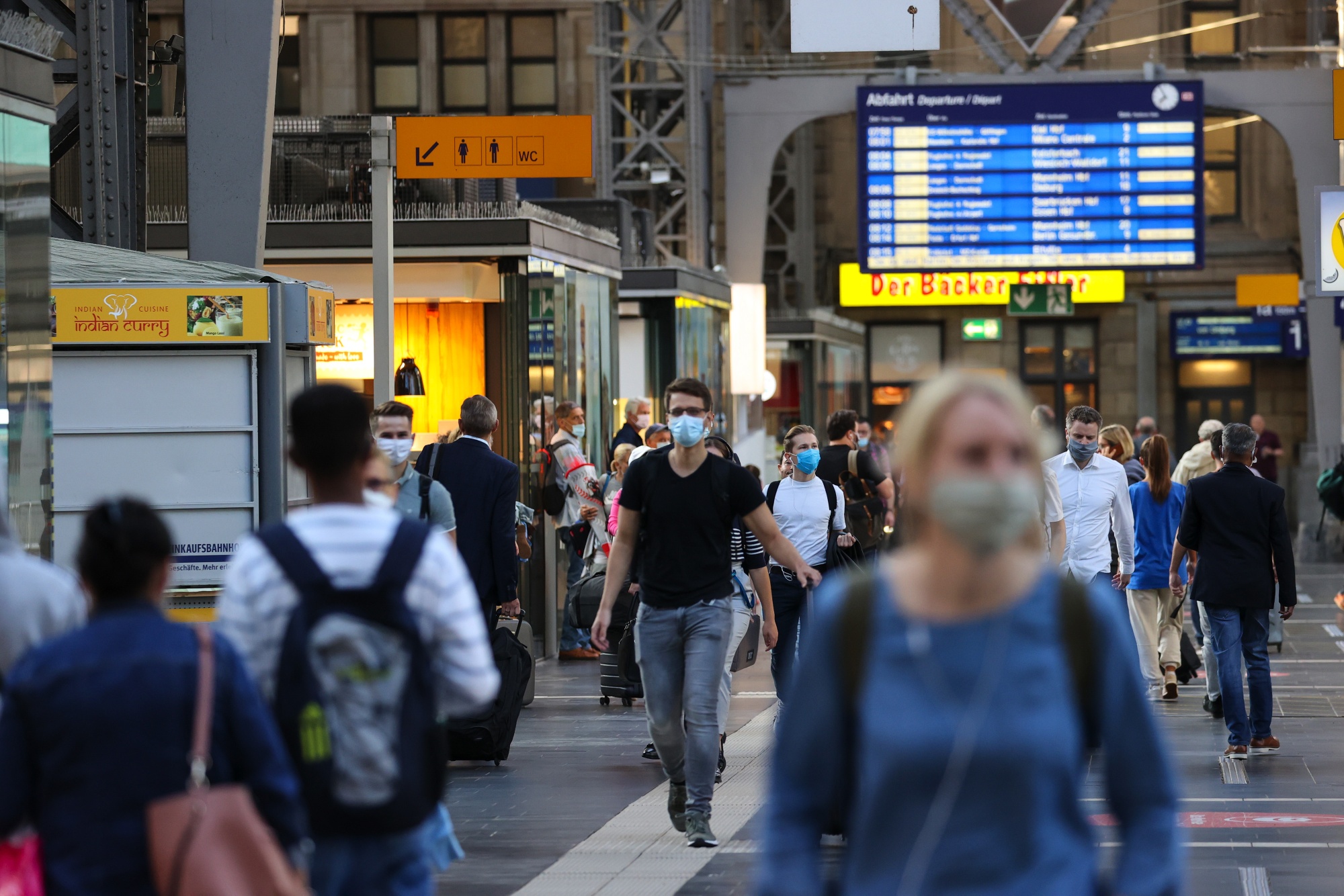 Commuters wear protective face masks during morning rush hour at Frankfurt Hauptbahnhof central train station in Germany&nbsp;on Wednesday.