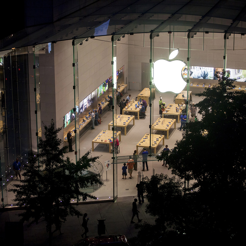 Shoppers look at products at the Upper West Side Apple Inc. store in New York.
