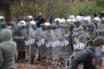 Polish police and military police face migrants at the Belarus-Poland border near Grodno on Nov. 8.