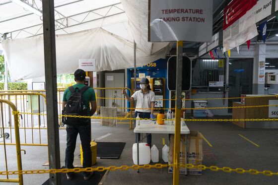 Singapore Keeps Dorm Migrants Segregated Even as Covid Abates
