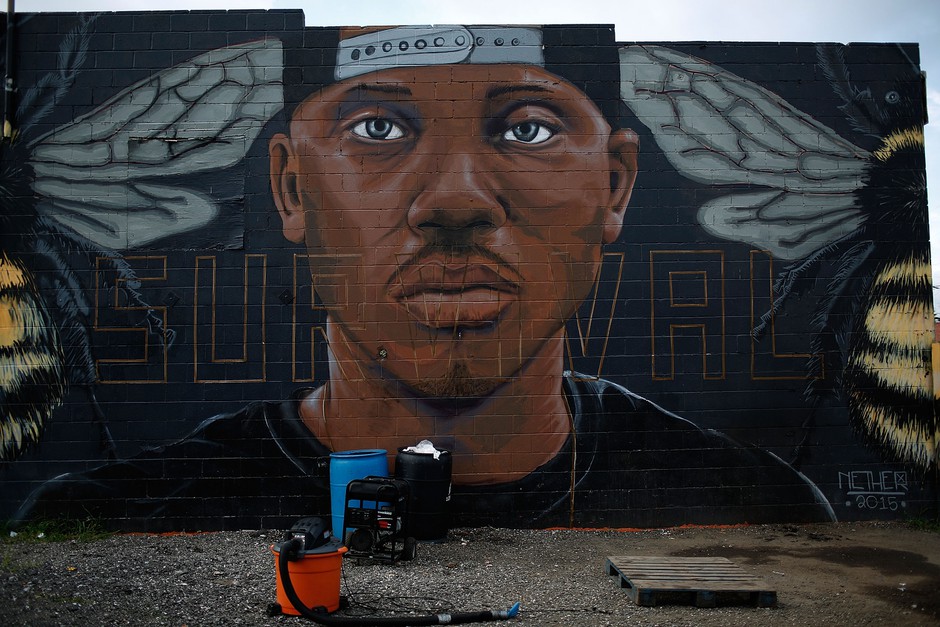 A mural of local anti-violence activist Kwame Rose on a wall in West Baltimore. The city's community activist community is being credited with keeping local protests peaceful.