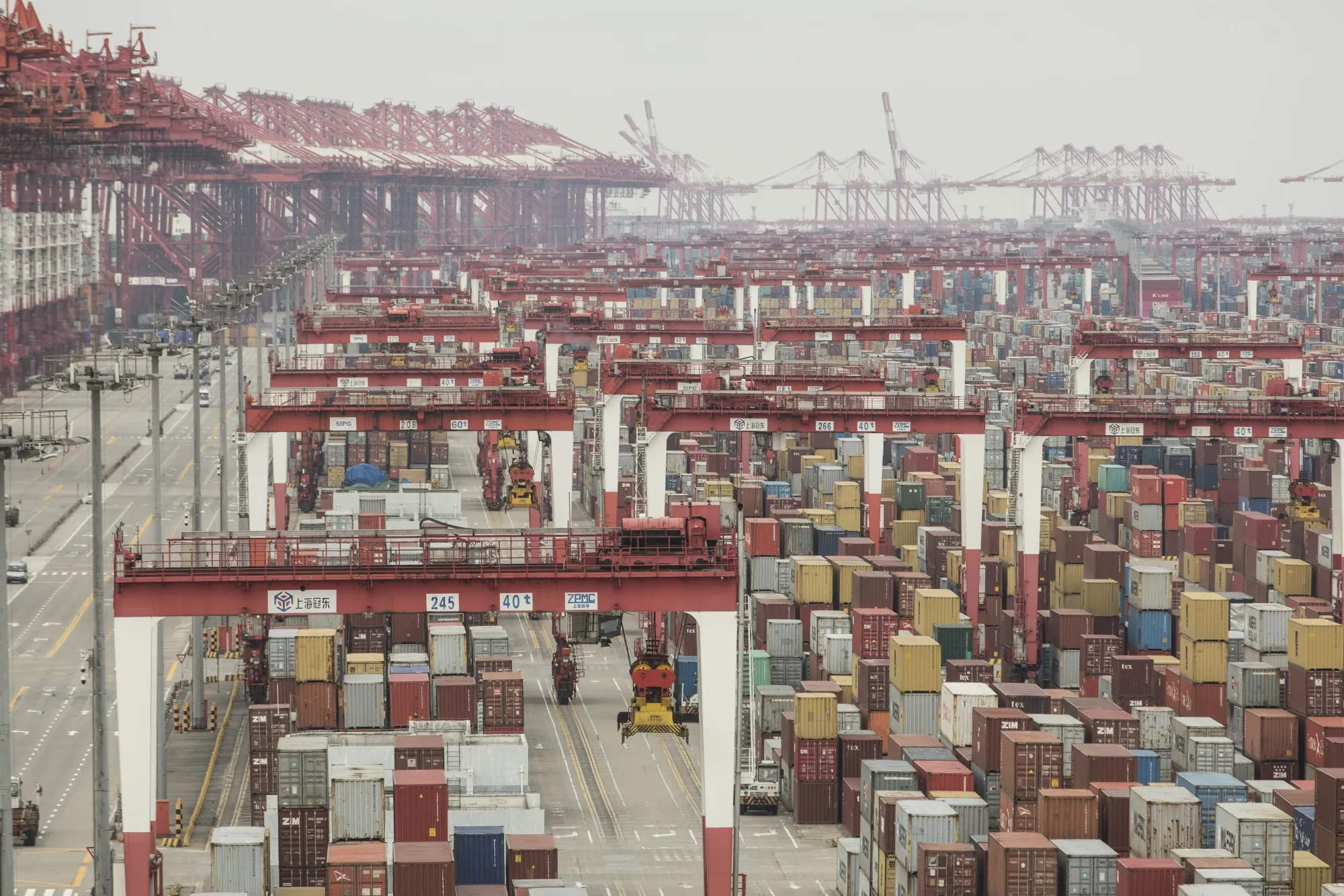 Shipping containers next to gantry cranes at the Yangshan Deep Water Port in Shanghai on Feb. 4.