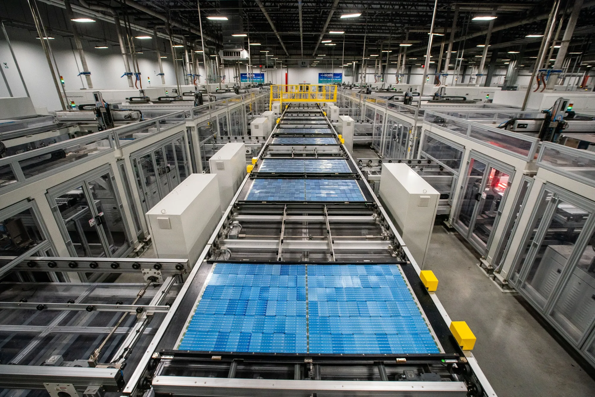 Solar panel cells move along a conveyor prior to lamination and framing at the Hanwha Q Cells manufacturing facility in Dalton, Georgia, US.