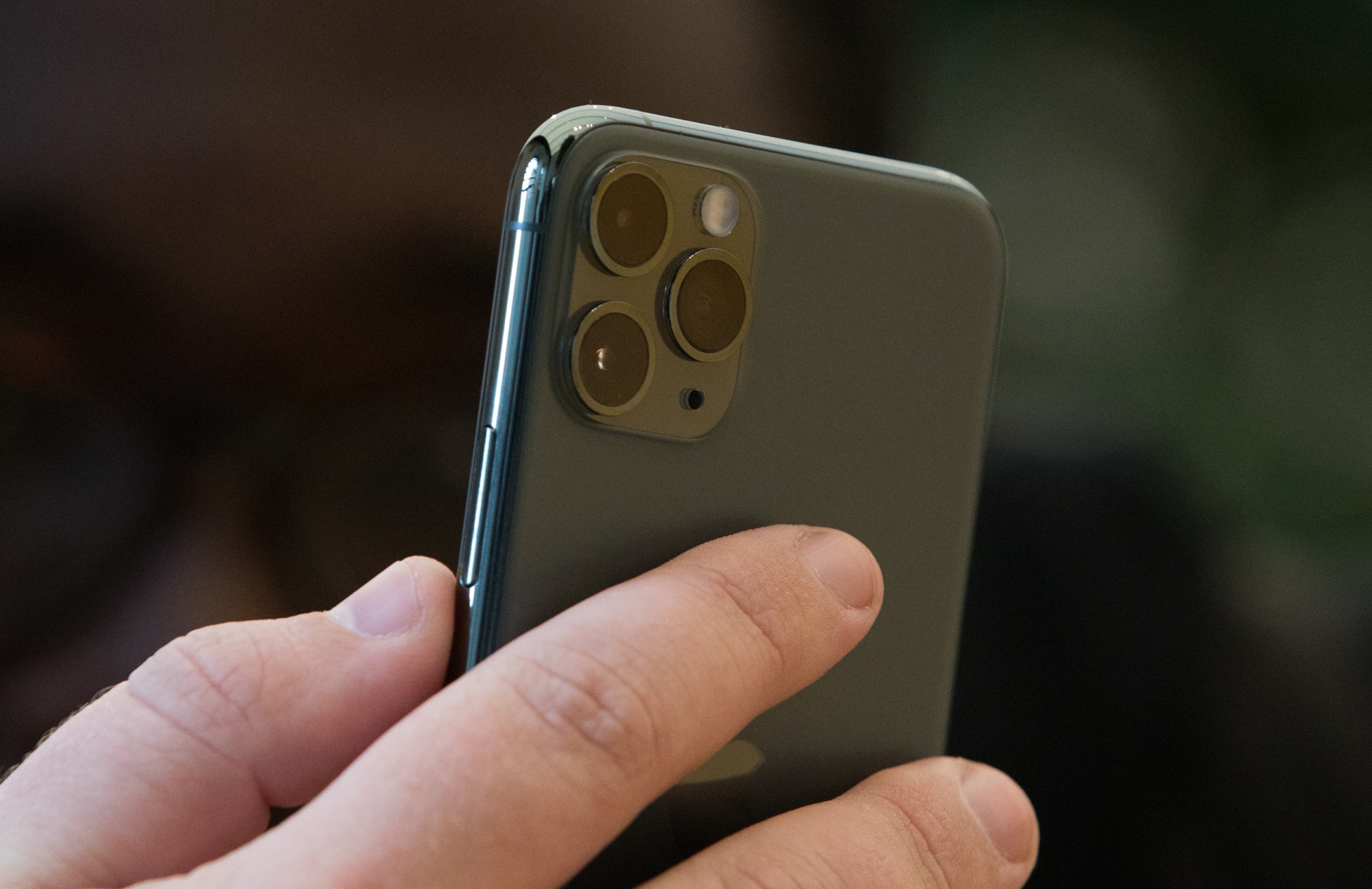 Triple‑camera lenses on the rear casing of an Apple Inc. iPhone 11 Pro.