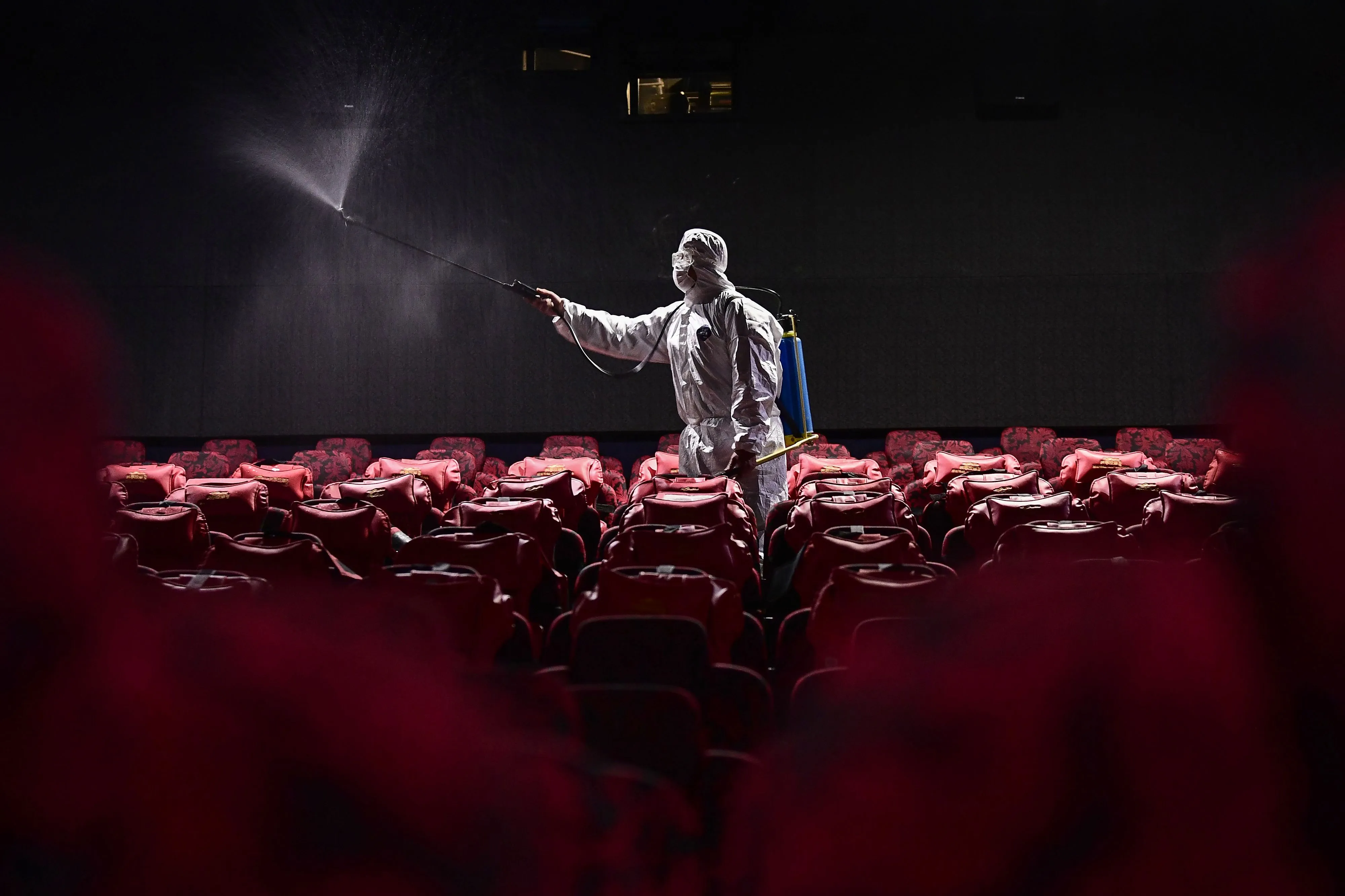 A worker sprays disinfectant at a cinema in Shenyang,&nbsp;China.&nbsp;