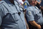Members of the Ferguson Police Department wear body cameras during a rally in Ferguson, Missouri, on Aug. 30, 2014.
