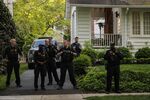 Law enforcement officers stand outside the home of Supreme Court Justice Brett Kavanaugh in Chevy Chase, Maryland, on May 11. 