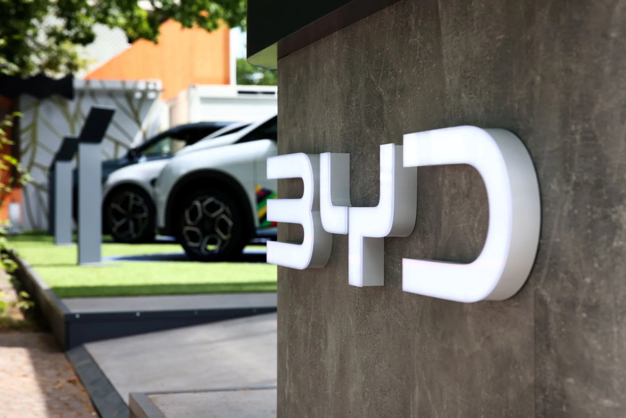 Electric vehicles on display at a BYD Co. sponsorship stand&nbsp;in Berlin.