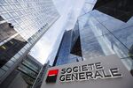 The Societe Generale SA logo sits on a sign outside the bank's headquarters in La Defense business district in Paris, France.